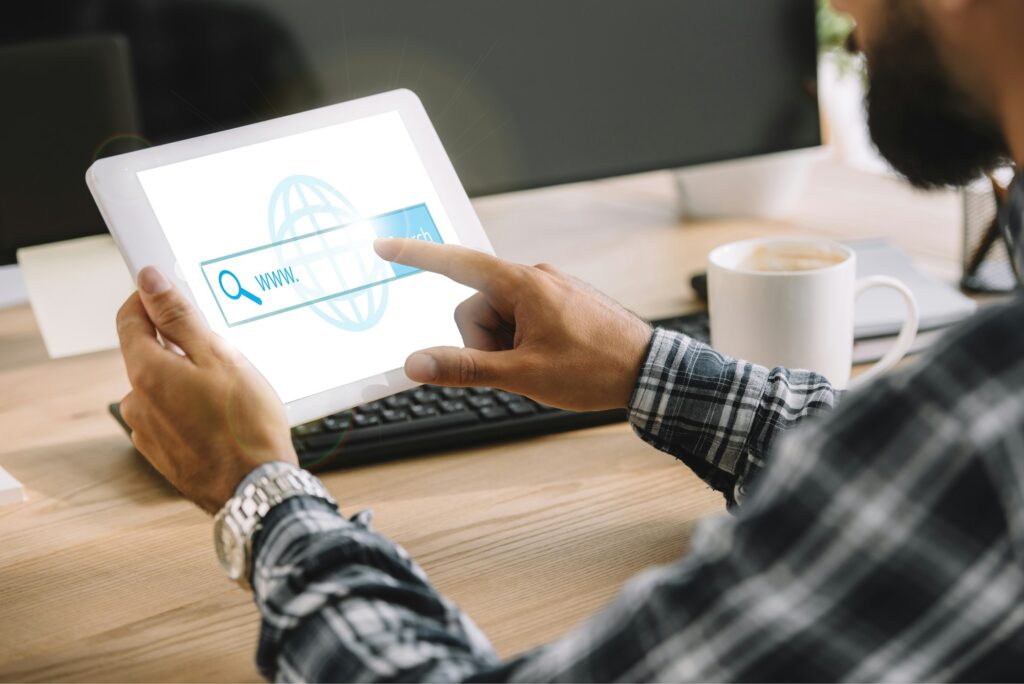 cropped shot of seo manager using tablet with website on screen